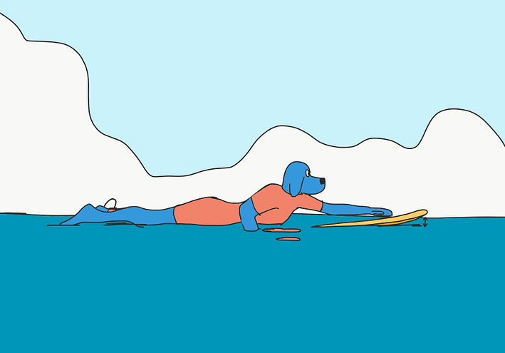 Assiette de la planche avec un surfeur allongé dessus